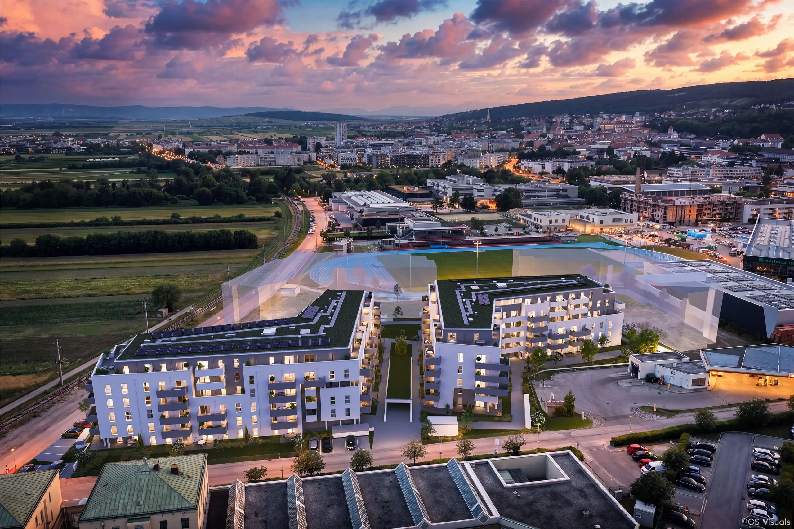 Luftaufnahme des Wohnprojekts Zielgerade in Eisenstadt in der Abenddämmerung